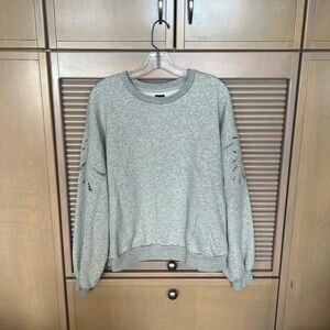 Grey GAP sweatshirt with eyelet cutout detail.